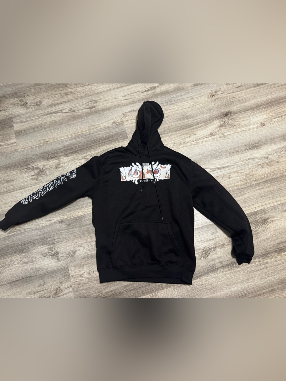 One piece Black Graphic Hoodie with Eye Design. Men’s large
